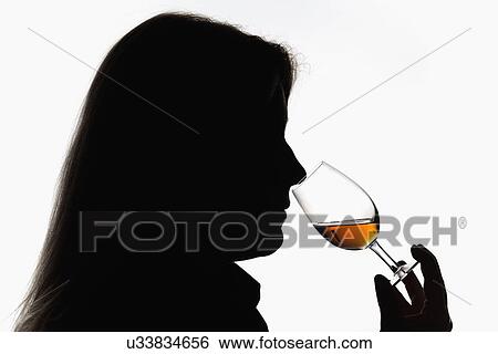 Stock Photograph - Worker smelling whisky in distillery. Fotosearch