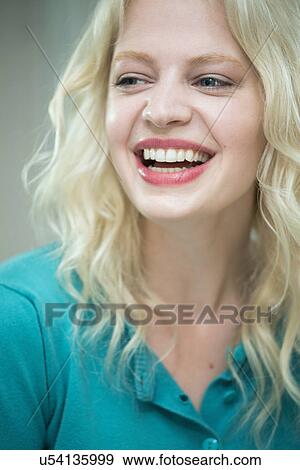Stock Photo - Young woman laughing. Fotosearch