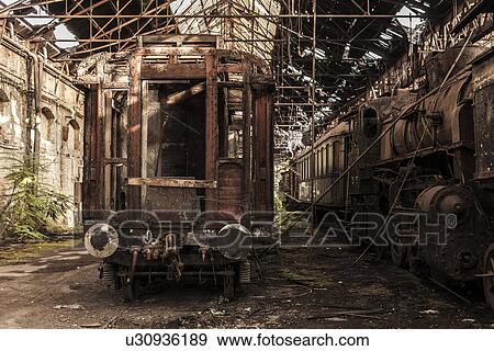 "Abandoned train carriage in railway shed, Inota, Hungary" View Large Photo Image Stock Photo - "Abandoned train carriage in railway shed, Inota, Hungary". Fotosearch