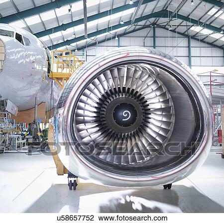 Stock Image - Aircraft engine in aircraft maintenance factory. Fotosearch