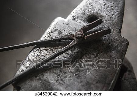 Stock Image - "Anvil, tong". Fotosearch