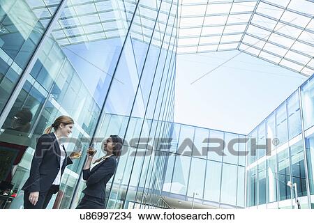 Picture - Businesswomen having drinks. Fotosearch