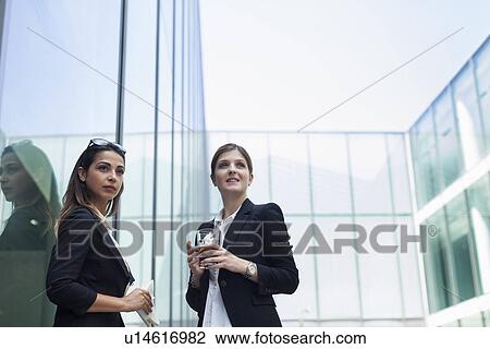 Businesswomen having lunch and ale View Large Photo Image Stock Image - Businesswomen having lunch and ale. Fotosearch