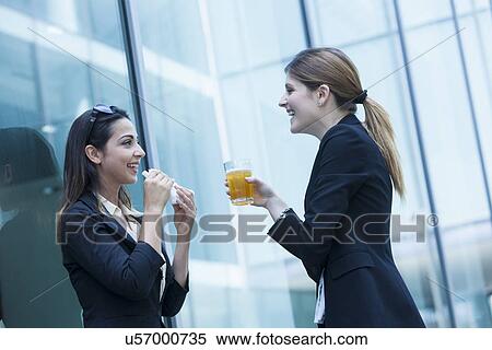 Stock Photography - Businesswomen having lunch. Fotosearch