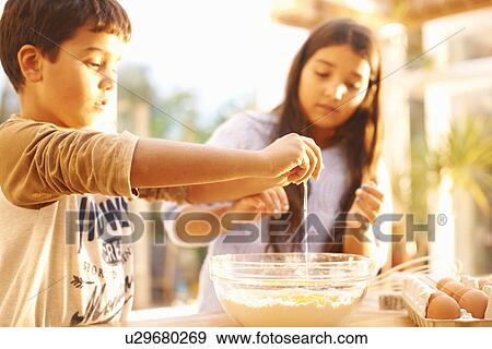 Stock Photo - Children baking in kitchen. Fotosearch