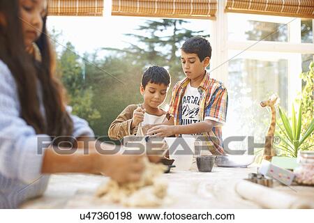 Children making dough in kitchen View Large Photo Image Stock Photo - Children making dough in kitchen. Fotosearch