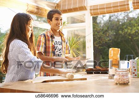 Children making dough in kitchen View Large Photo Image Stock Photograph - Children making dough in kitchen. Fotosearch