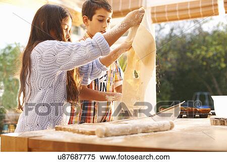 Children making dough in kitchen View Large Photo Image Stock Photography - Children making dough in kitchen. Fotosearch