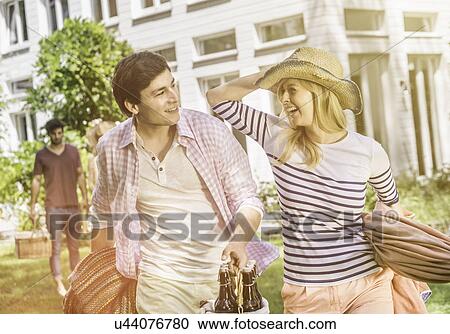 Couple in garden smiling View Large Photo Image Stock Image - Couple in garden smiling. Fotosearch