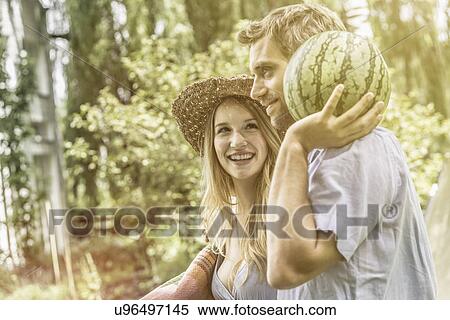 Stock Photography - Couple with watermelon. Fotosearch