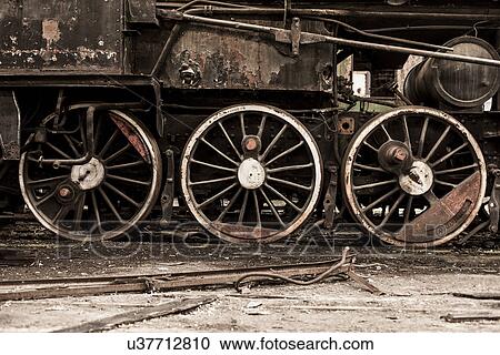 "Detail of steam train wheels in railway shed, Inota, Hungary" View Large Photo Image Stock Image - "Detail of steam train wheels in railway shed, Inota, Hungary". Fotosearch