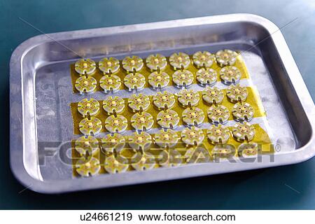 Electrical components on tray in LED factory View Large Photo Image Stock Photo - Electrical components on tray in LED factory. Fotosearch