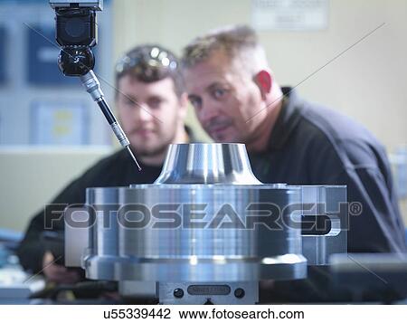 Engineer and apprentice measuring finished part View Large Photo Image Stock Image - Engineer and apprentice measuring finished part. Fotosearch