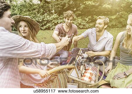 Friends drinking beer in garden View Large Photo Image Stock Photo - Friends drinking beer in garden. Fotosearch