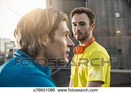 "Friends taking break on bridge, Munich, Bavaria, Germany" View Large Photo Image Stock Photograph - "Friends taking break on bridge, Munich, Bavaria, Germany". Fotosearch