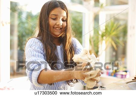 Girl making dough in kitchen View Large Photo Image Stock Image - Girl making dough in kitchen. Fotosearch
