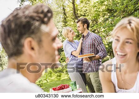Group of friends at garden party View Large Photo Image Stock Image - Group of friends at garden party. Fotosearch