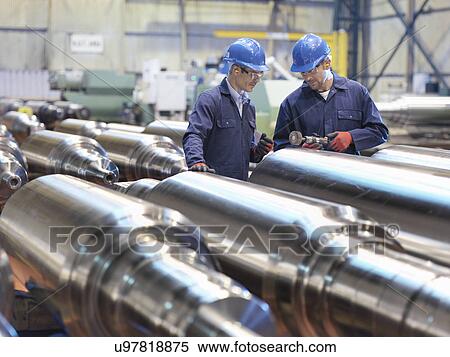 Stock Photography - Hardness testing of steel part in engineering factory. Fotosearch