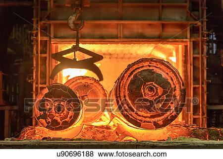 Stock Photo - Hot steel castings in furnace of steelworks. Fotosearch