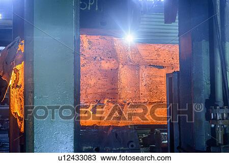Hot steel in forging press in steelworks View Large Photo Image Stock Image - Hot steel in forging press in steelworks. Fotosearch