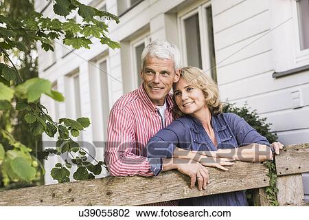Husband and wife relaxing in garden View Large Photo Image Stock Image - Husband and wife relaxing in garden. Fotosearch