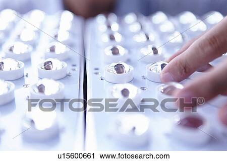 Stock Image - "LED bulbs in factory, close up". Fotosearch