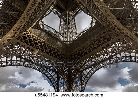 Picture - "Low angle symmetrical view of Eiffel Tower, Paris, France". Fotosearch