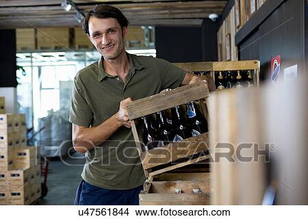 Man working in wine warehouse View Large Photo Image Picture - Man working in wine warehouse. Fotosearch