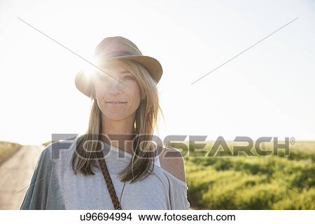 Mid adult woman on country road View Large Photo Image Picture - Mid adult woman on country road. Fotosearch