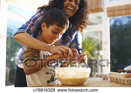 Mother and son baking in kitchen View Large Photo Image Stock Photo - Mother and son baking in kitchen. Fotosearch