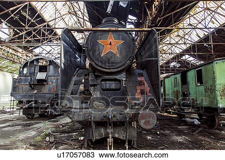 "Old abandoned steam trains in railway shed, Inota, Hungary" View Large Photo Image Stock Image - "Old abandoned steam trains in railway shed, Inota, Hungary". Fotosearch