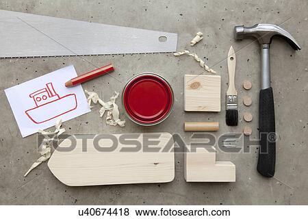 "Overhead view of drawing, paint and tools to make toy boat" View Large Photo Image Stock Photo - "Overhead view of drawing, paint and tools to make toy boat". Fotosearch
