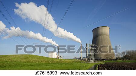 Ploughed field in front of power station View Large Photo Image Stock Image - Ploughed field in front of power station. Fotosearch
