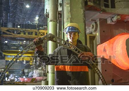 Stock Image - Portrait of apprentice steelworker. Fotosearch