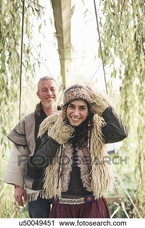 Portrait of mature hippy couple in garden View Large Photo Image Stock Image - Portrait of mature hippy couple in garden. Fotosearch