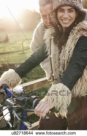 Portrait of mature hippy couple with cycle on rural road View Large Photo Image Picture - Portrait of mature hippy couple with cycle on rural road. Fotosearch