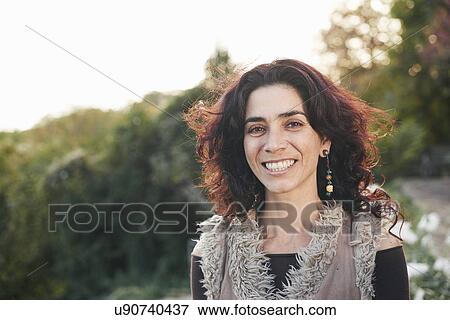 Portrait of mature hippy female in garden View Large Photo Image Stock Photo - Portrait of mature hippy female in garden. Fotosearch