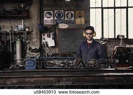 Stock Image - Portrait of welder in workshop. Fotosearch
