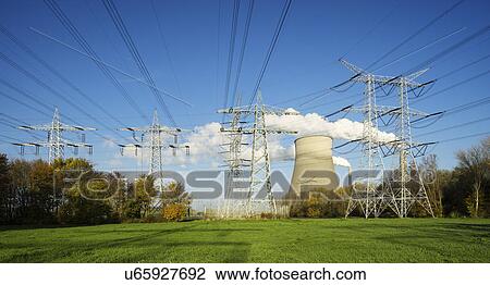 Rows of electrical towers in front of cooling tower and smoke stacks View Large Photo Image Stock Image - Rows of electrical towers in front of cooling tower and smoke stacks. Fotosearch