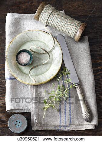 "Saucer, string, knife, herb, kitchen towel" View Large Photo Image Stock Image - "Saucer, string, knife, herb, kitchen towel". Fotosearch