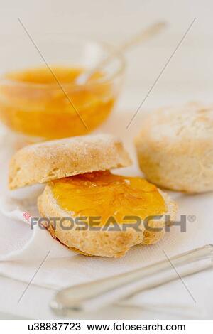 Stock Image - Scones and marmalade. Fotosearch