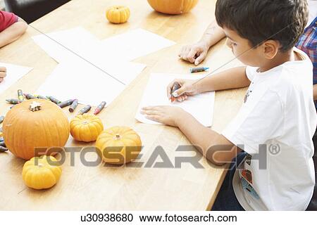 Siblings drawing at dining table View Large Photo Image Stock Image - Siblings drawing at dining table. Fotosearch