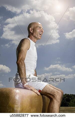 Sportsman resting on pommel horse View Large Photo Image Stock Photo - Sportsman resting on pommel horse. Fotosearch