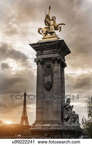 "Statue on Pont Alexandre III (bridge), Eiffel Tower in background, Paris, France" View Large Photo Image Stock Image - "Statue on Pont Alexandre III (bridge), Eiffel Tower in background, Paris, France". Fotosearch
