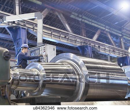 Stock Photograph - Steel part on lathe in engineering factory. Fotosearch