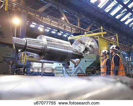 Steel roller on lathe in engineering factory View Large Photo Image Stock Photography - Steel roller on lathe in engineering factory. Fotosearch