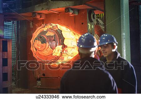 "Steelworkers with 10, 000 tonne forging press in steelworks" View Large Photo Image Stock Photograph - "Steelworkers with 10, 000 tonne forging press in steelworks". Fotosearch