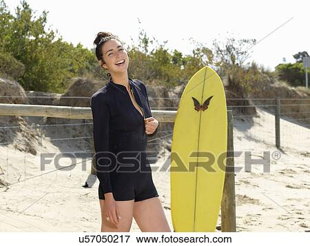 Stock Photo - "Surfer enjoying beach, Roadknight, Victoria, Australia". Fotosearch