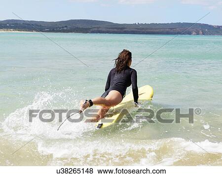 Stock Photo - "Surfer in sea, Roadknight, Victoria, Australia". Fotosearch
