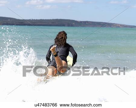 "Surfer in sea, Roadknight, Victoria, Australia" View Large Photo Image Stock Photograph - "Surfer in sea, Roadknight, Victoria, Australia". Fotosearch